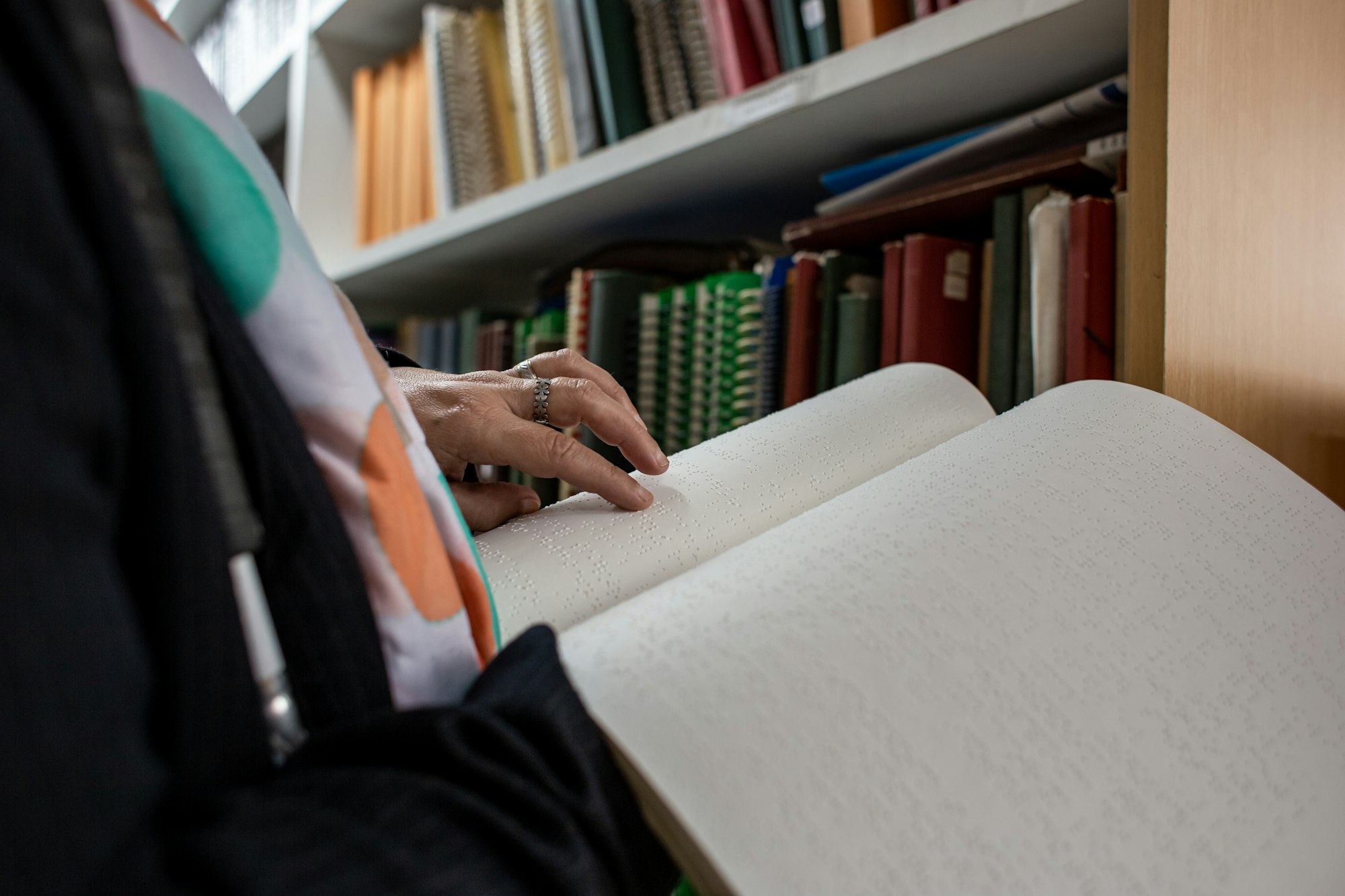 Blind person with a book in braille language, Disability concept